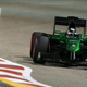 A photo of the 2014 Caterham F1 car racing in Bahrain.